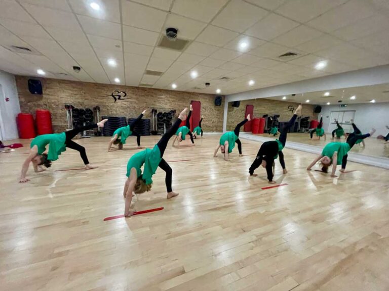Pupils practising bridges in Acrobatic Arts