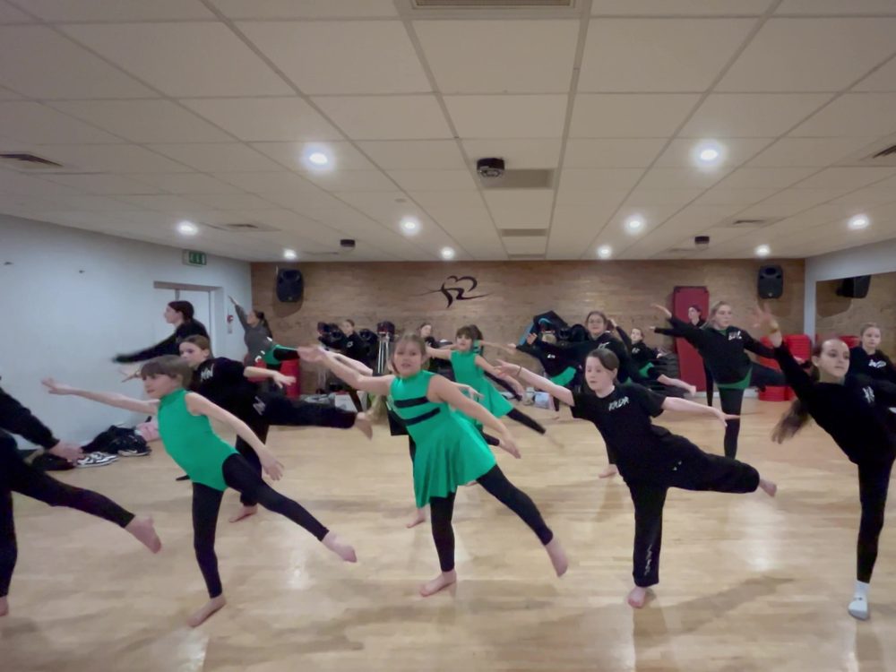 KADA pupils holding an arabesque together in class