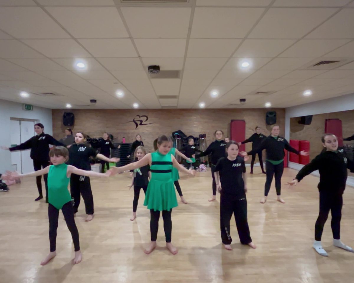 A KADA class practising a routine together in the studio