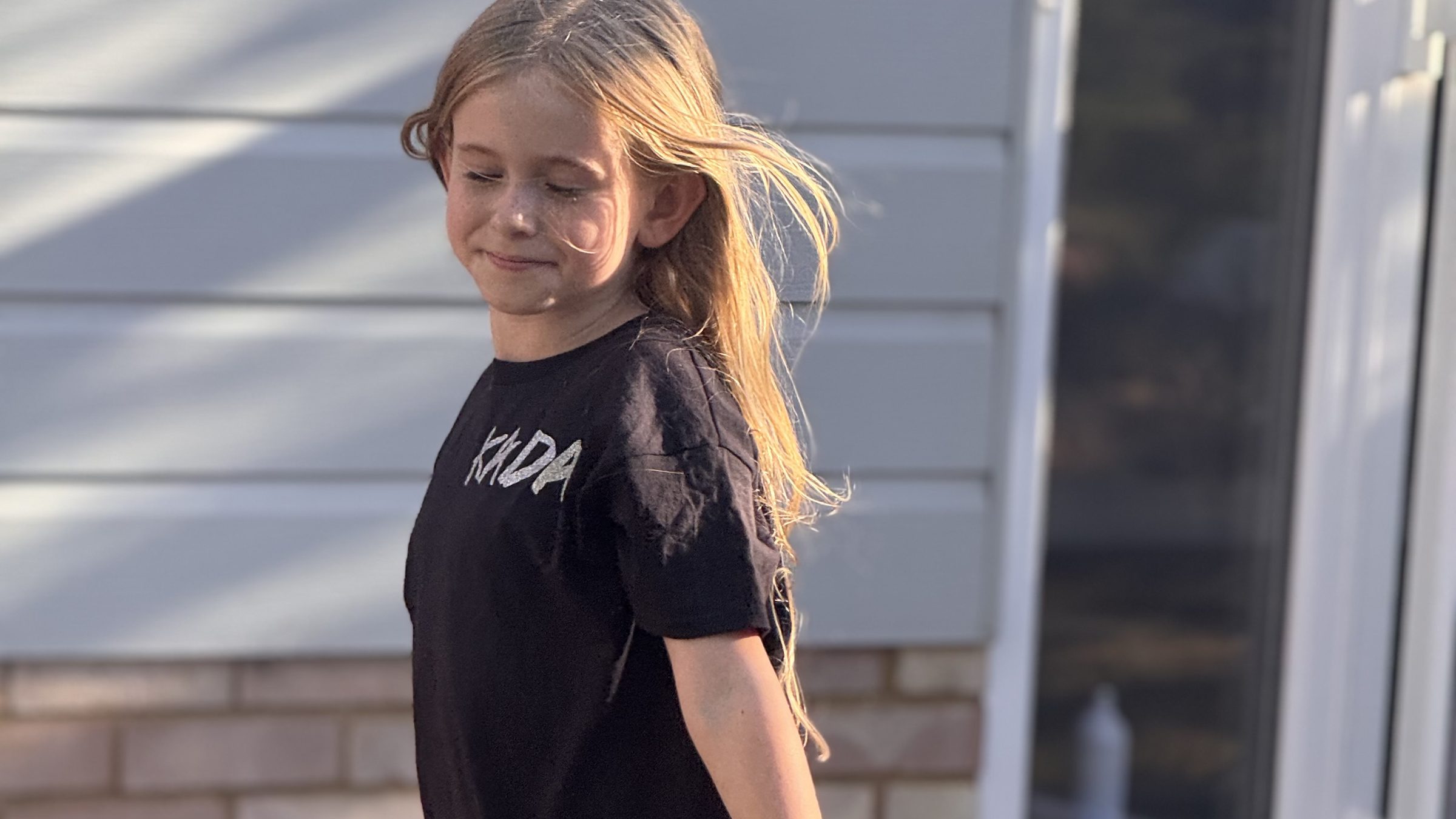 A KADA dancer in her KADA T-shirt