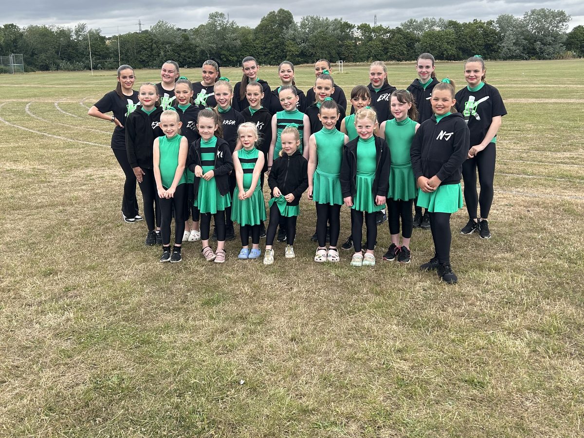 KADA dancers lined up for a photo at an outdoor show